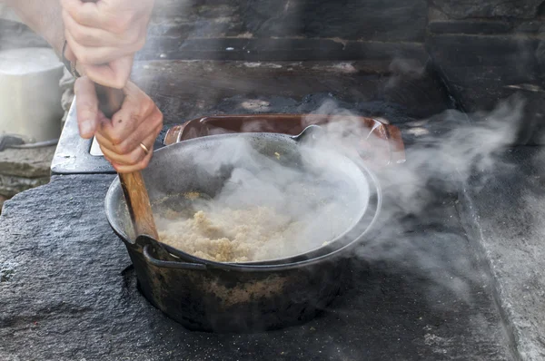 stock image Cooking polenta on wood stove