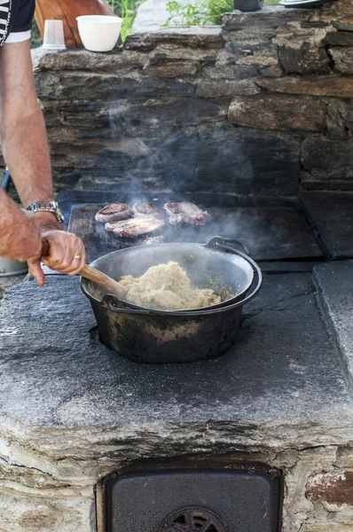 stock image Cooking polenta on wood stove