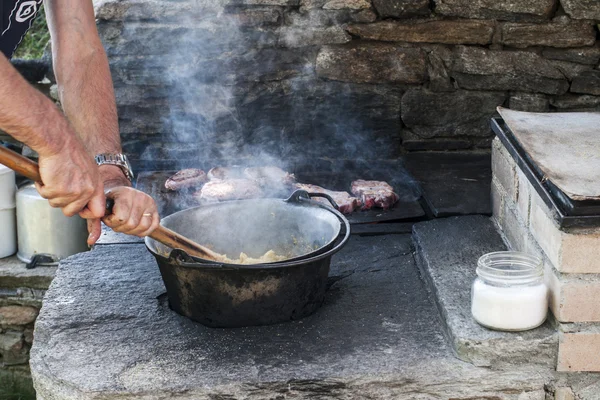 stock image Cooking polenta on wood stove