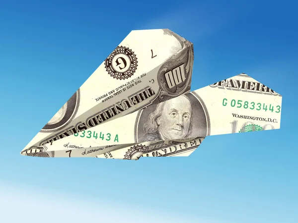 Самолет с банкнотами в долларах — стоковое фото