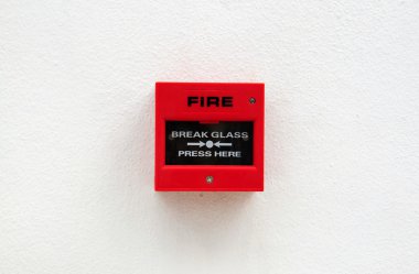 Red fire alarm on the grunge wall clipart