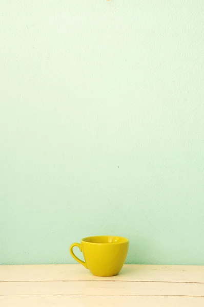 stock image Green coffee cup on the white wood