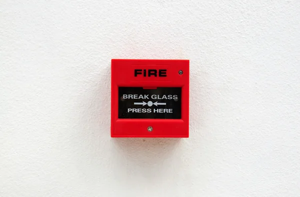 Roter Feueralarm an der Grunge-Wand — Stockfoto