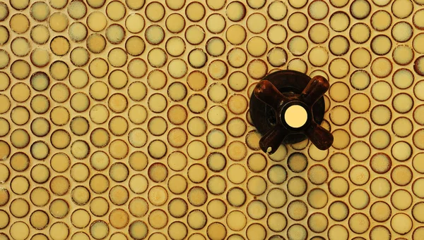 Shower knob on circular tile — Stock Photo, Image