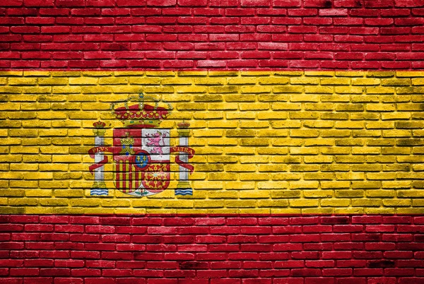 stock image Spain flag painted on old brick wall