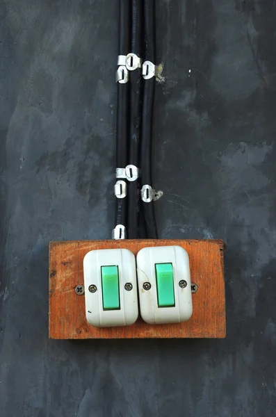 Velho interruptor na parede de cimento — Fotografia de Stock