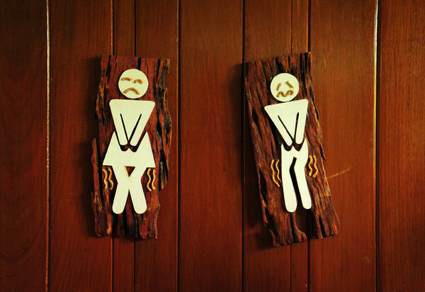 Toilet funny signs on the wood