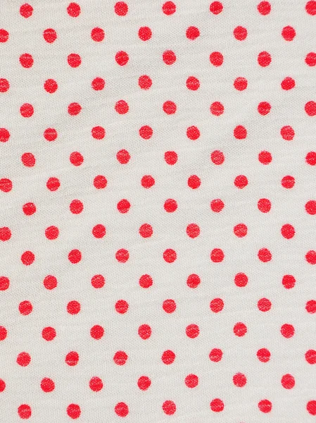 Röd ploka prick på vitt tyg textur — Stockfoto