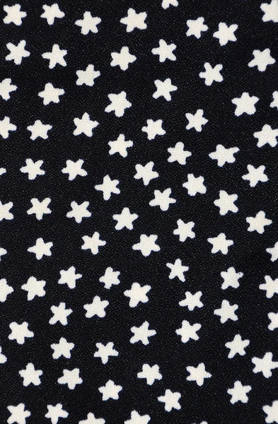Vintage white flower on black fabric — Stock Photo, Image