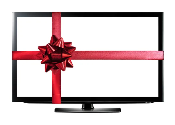 TV led o LCD con cinta de regalo de Navidad roja aislada en blanco — Foto de Stock