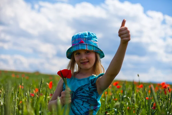 Young blond girl with red flowers — Stock Photo, Image