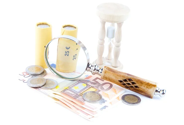 Financial concept. Money and magnifying glass — Stock Photo, Image