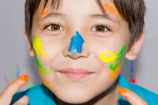 Happy kid with paints on hands — Stock Photo, Image