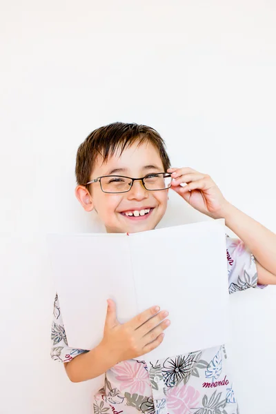 Boy reading a book with enthusiasm — Stock Photo, Image