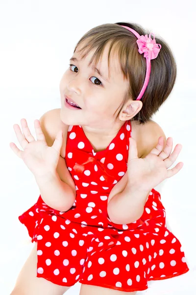 A little girl in red dress — Stock Photo, Image