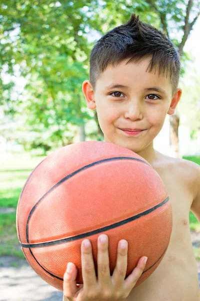 stock image A little boy with ball in his hands