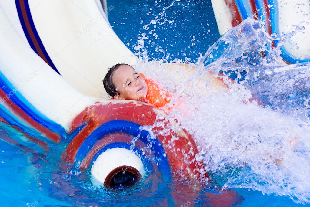 Little girl on a water slide