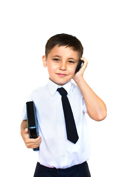 Jongen houdt een laptop en praten over de telefoon — Stockfoto
