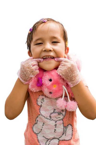 A little girl in a pink dress hamming — Stock Photo, Image