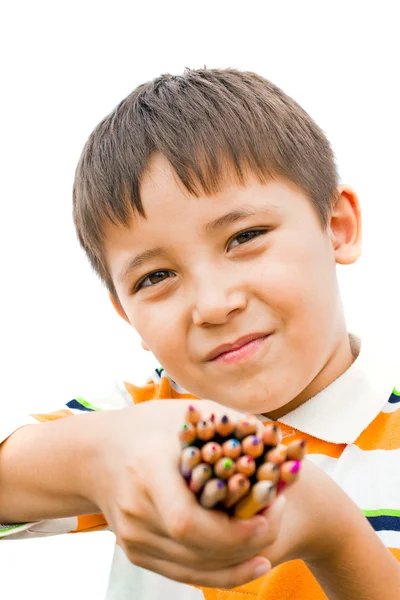 Pojke med färgpennor i händerna — Stockfoto