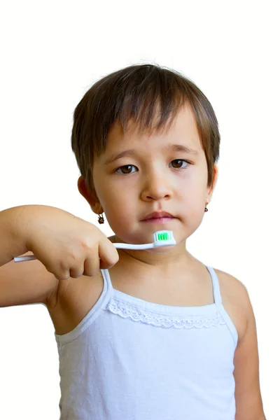 Niña sosteniendo un cepillo de dientes —  Fotos de Stock