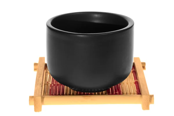 Zwarte cup op een stand — Stockfoto