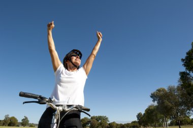 Happy joyful healthy mature female cyclist clipart