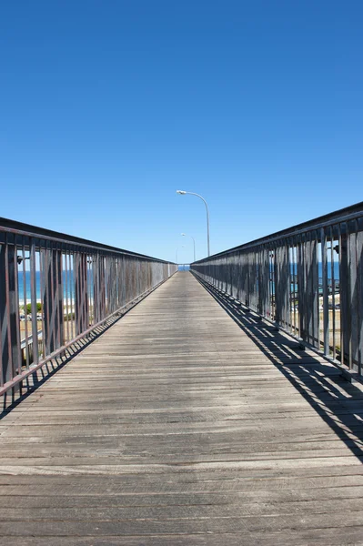 Boardwalk into the blue sky — Stock Photo, Image