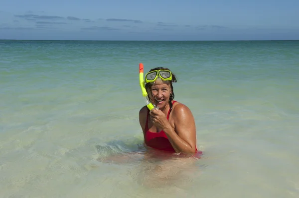 Sexy woman snorkel swim holiday beach — Stock Photo, Image
