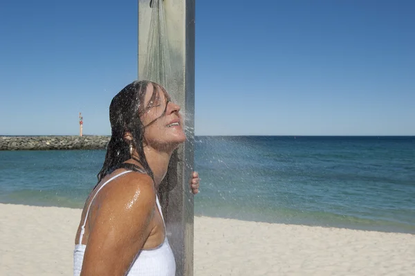 Sexy woman refreshing shower outdoor at beach — Stock Photo, Image