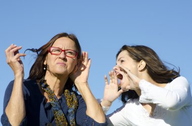 Shouting and listening between two generations clipart