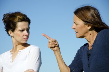Mother and daughter, two generations, having an argument clipart