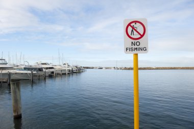 No Fishing sign in yacht harbour clipart