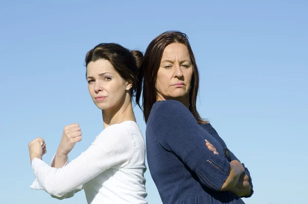 Strong and stubborn women back to back — Stock Photo, Image