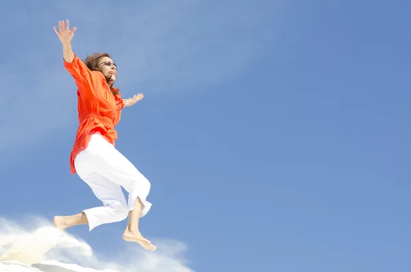 Mature woman jumping with joy — Stock Photo, Image