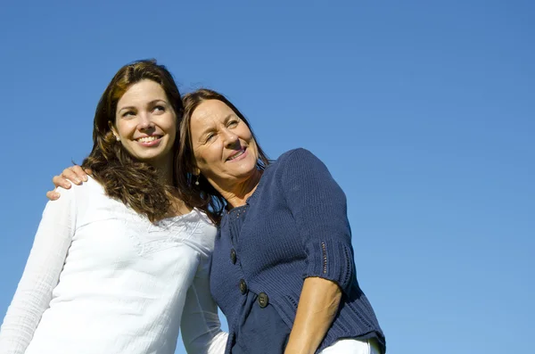 Mother and daughter hugging in friendship — Stock Photo, Image