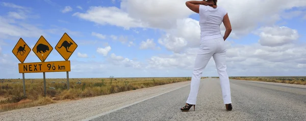 stock image Woman on outback highway in Australian