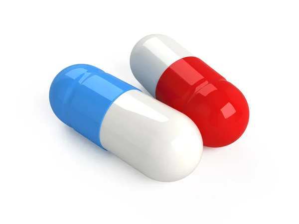 Красные и синие таблетки — стоковое фото