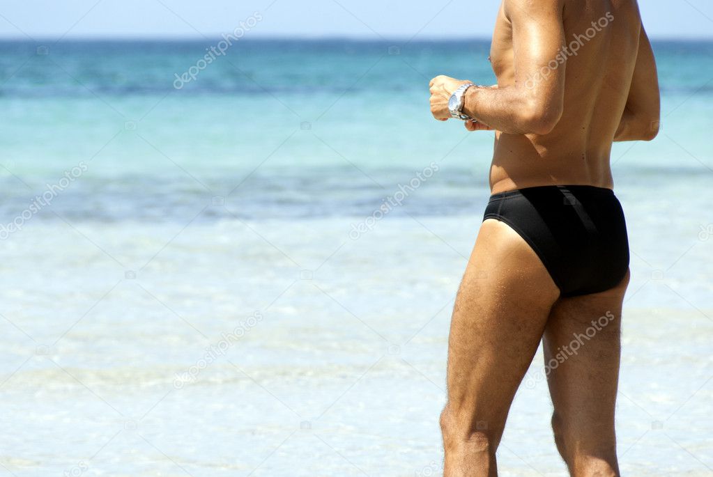 Tanned man against a sea background