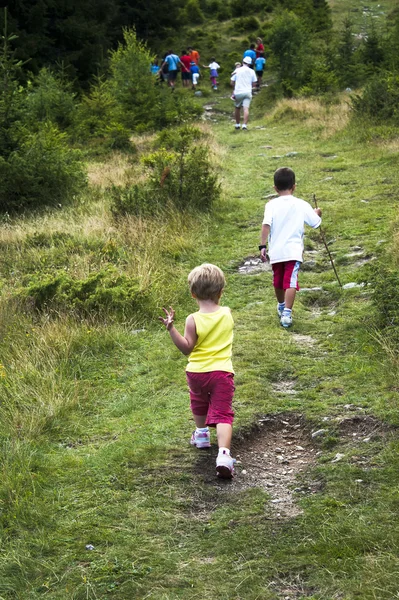 stock image Children walking in mountain