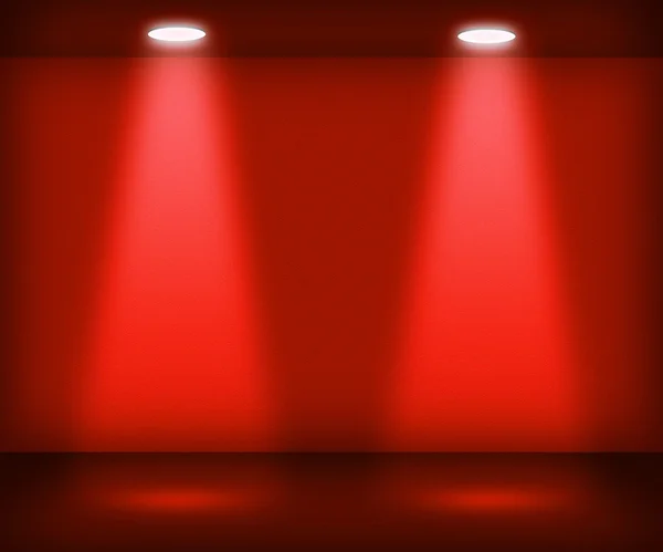 Червона кімната з двома прожекторами — стокове фото
