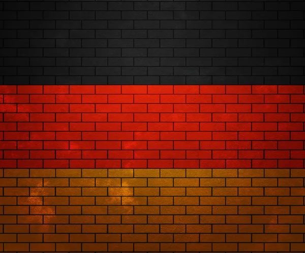 벽돌 벽에 걸려 있는 독일의 국기 — 스톡 사진