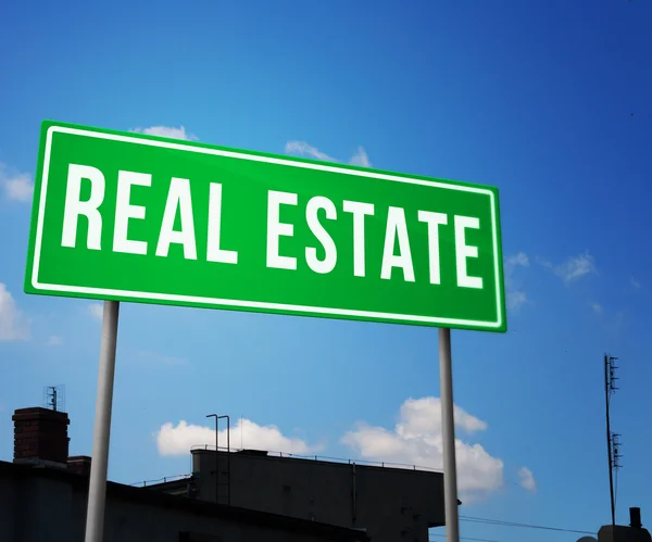 Real Estate on Road Sign — Stock Photo, Image