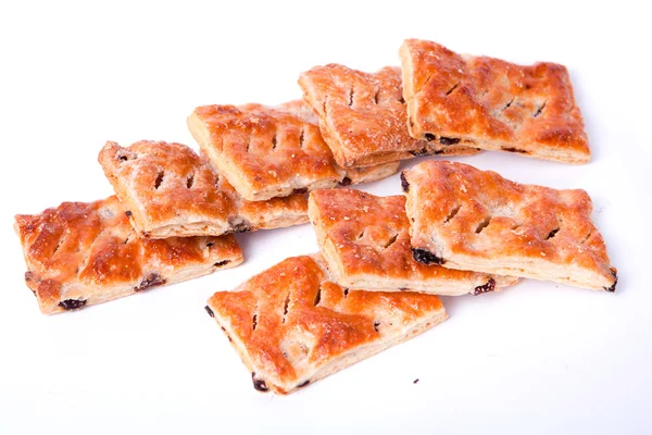 stock image Cookies from flaky pastry with raisin on a white background