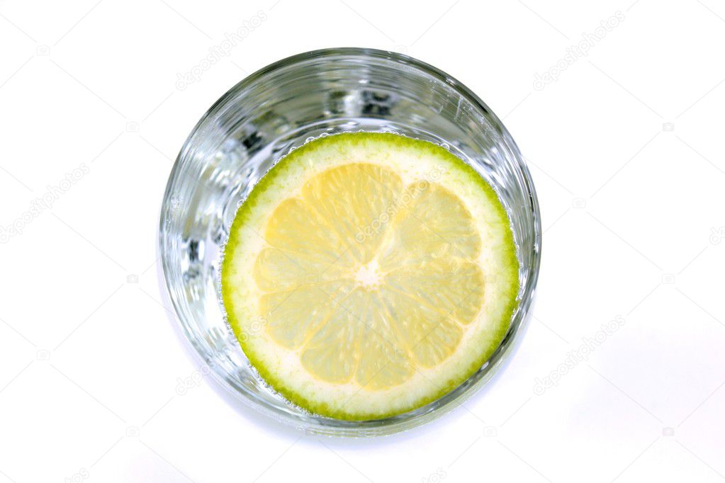 Drink in glass and lime slice , top view, on white background