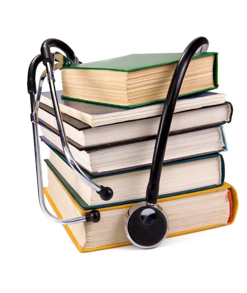 Stos starych książek i stetoskop — Zdjęcie stockowe