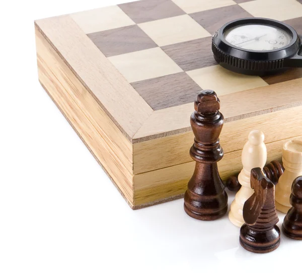Chess piece with board and watch on white — Stock Photo, Image