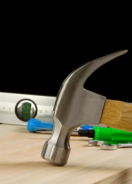 Hammer and other tool on wood — Stock Photo, Image