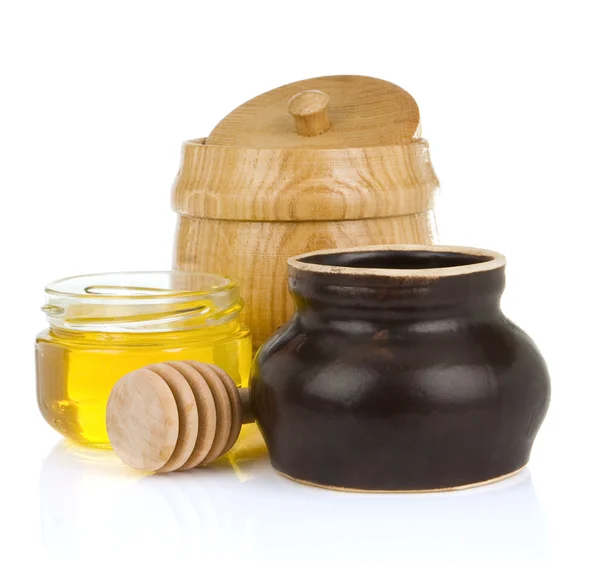 Jars and pot of honey isolated on white — Stock Photo, Image