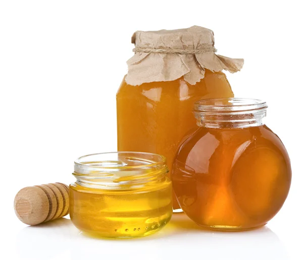 Glass jar and pot of honey with stick — Stock Photo, Image